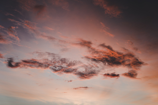 View of a dramatic sunset sky with vibrant orange and purple clouds drifting across the horizon in Merikula Harju maakond Estonia. View of a dramatic sunset sky with vibrant orange and purple clouds drifting across the horizon in Merikula Harju maakond Estonia.
