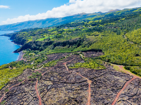 Aerial view of the rugged coastline meeting the verdant hills a symphony of blues and greens under a vast sky Pico Azores Portugal. Aerial view of the rugged coastline meeting the verdant hills a symphony of blues and greens under a vast sky Pico Azores Portugal.