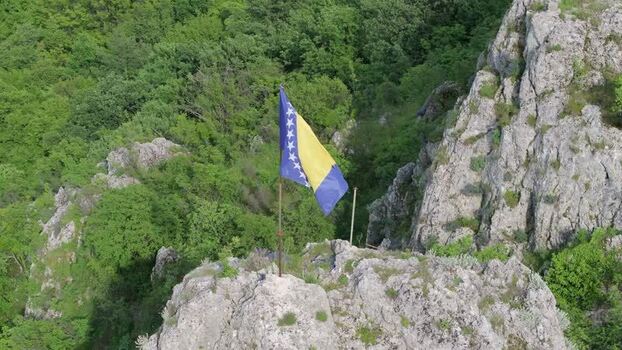 Aerial view of the national flag on a rocky cliff Bosnia and Herzegovina. Aerial view of the national flag on a rocky cliff Bosnia and Herzegovina.