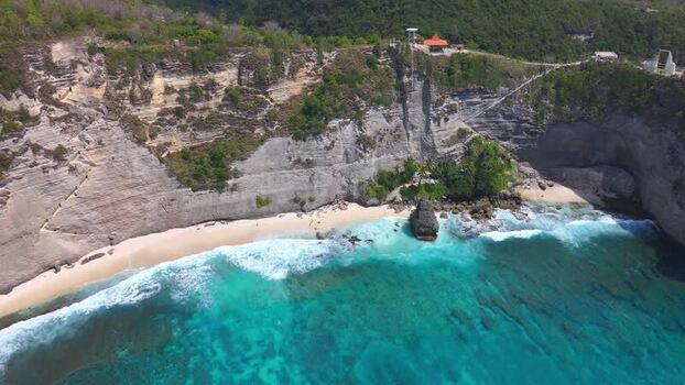 Aerial view of Diamond Beach with turquoise waves and cliffs Indonesia. Aerial view of Diamond Beach with turquoise waves and cliffs Indonesia.