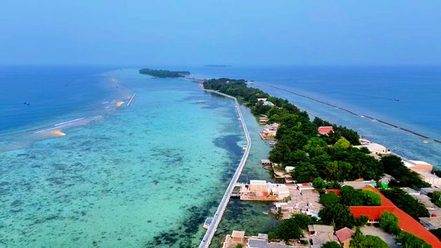 Aerial view of Pulau Tidung Besar with its long bridge connecting the islands surrounded by turquoise waters and lush vegetation in South Kepulauan Seribu Jakarta Indonesia.