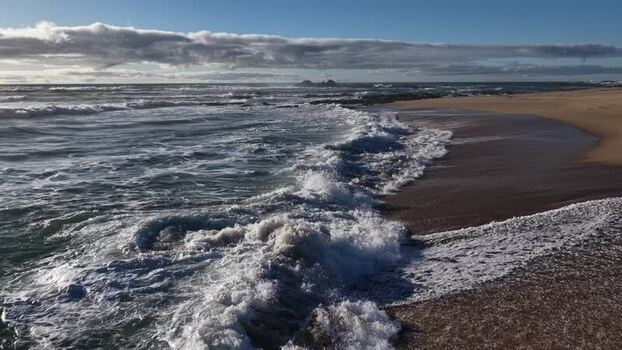 Aerial view of beach and ocean waves Portugal.