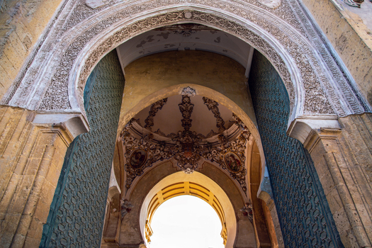 Cordoba Spain 04 September 2026 View of the intricate Moorish archway and ornate ceiling details at the Mosque Cathedral Monumental Site of Cordoba showcasing historic architecture.