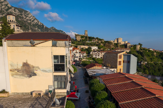 Kruje Albania 12 June 2026 Aerial view of Kruje Castle and the historic old town featuring traditional rooftops stone walls and the surrounding mountains under a clear sky.
