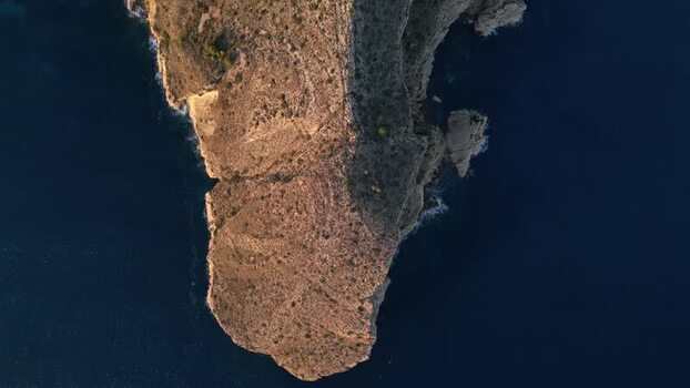 Aerial view of the rugged coastal cliffs in Moraira Spain.