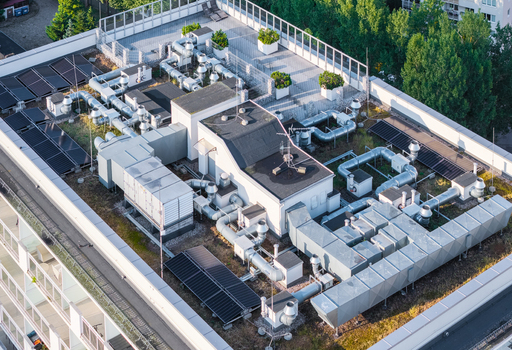 Aerial view of HVAC systems and ventilation ducts installed on a modern building rooftop in Gdansk Pomeranian Voivodeship Poland.