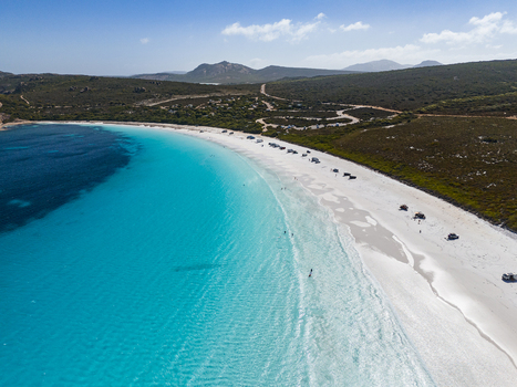 Aerial view of Lucky Bay with white sand beach and turquoise water surrounded by coastal vegetation under a clear sky in Cape Le Grand National Park Western Australia Australia. Aerial view of Lucky Bay with white sand beach and turquoise water surrounded by coastal vegetation under a clear sky in Cape Le Grand National Park Western Australia Australia.