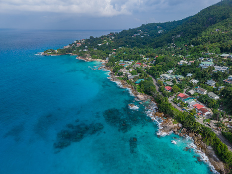 Aerial view of turquoise waters meeting the lush green coastlines near Vista do Mar creating a vibrant contrast of nature s beauty Vista do Mar Mahe Island Seychelles. Aerial view of turquoise waters meeting the lush green coastlines near Vista do Mar creating a vibrant contrast of nature s beauty Vista do Mar Mahe Island Seychelles.