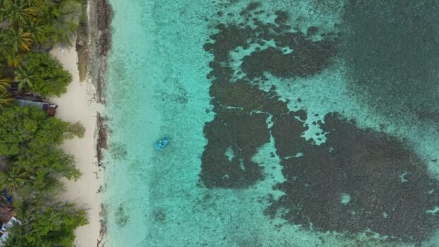 Aerial view of clear waters and island Maldives. Aerial view of clear waters and island Maldives.