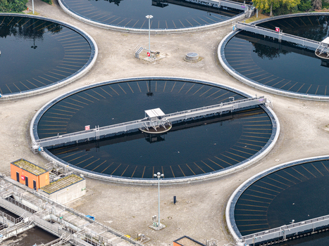 Aerial view of the circular sedimentation tanks at the Klarwerk Ruhleben sewage treatment plant with industrial infrastructure in Berlin Berlin Germany.