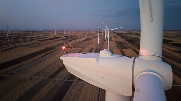 Aerial view of wind turbines in a field at sunset in Vladimirovac Vojvodina Serbia. Aerial view of wind turbines in a field at sunset in Vladimirovac Vojvodina Serbia.