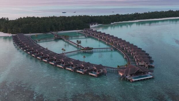 Aerial view of luxury overwater bungalows and lagoon Maldives. Aerial view of luxury overwater bungalows and lagoon Maldives.
