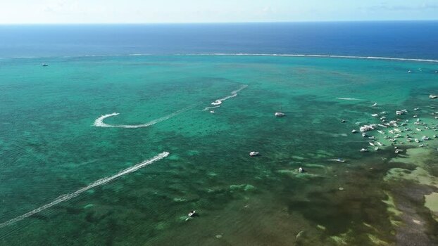 Aerial view of Grand Cayman with boats and jet skis Cayman Islands. Aerial view of Grand Cayman with boats and jet skis Cayman Islands.