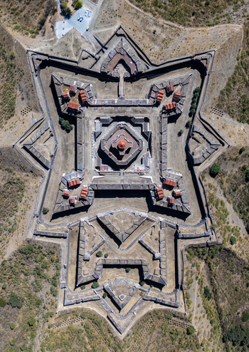 Elvas Portugal 10 September 2026 Aerial view of Forte de Nossa Senhora da Graca a historic star shaped fortification with stone walls and red tiled roofs. Elvas Portugal 10 September 2026 Aerial view of Forte de Nossa Senhora da Graca a historic star shaped fortification with stone walls and red tiled roofs.