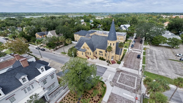 Aerial view of Ancient City Baptist Church with its distinctive steeple surrounded by historic buildings lush trees and brick paved streets in St. Augustine Florida United States. Aerial view of Ancient City Baptist Church with its distinctive steeple surrounded by historic buildings lush trees and brick paved streets in St. Augustine Florida United States.