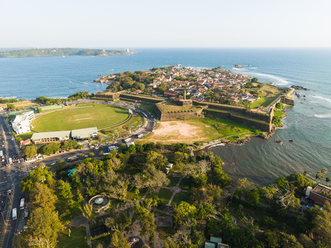 Aerial view of the historic Galle Fort and the cricket stadium along the coast with the Indian Ocean in the background Galle Southern Province Sri Lanka.