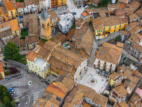 Aerial view of the historic center with terracotta rooftops the church of Santa Maria Maggiore and the central square in Pacentro Abruzzo Italy. Aerial view of the historic center with terracotta rooftops the church of Santa Maria Maggiore and the central square in Pacentro Abruzzo Italy.