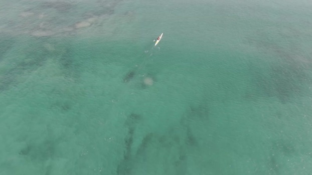 Aerial view of a person kayaking in Hartenbos South Africa.
