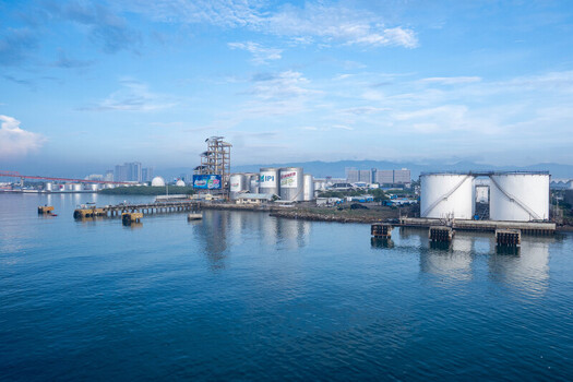 Cebu Central Visayas Philippines 23 September 2026 View of industrial storage tanks and port facilities along the coastline with the city skyline in the background. Cebu Central Visayas Philippines 23 September 2026 View of industrial storage tanks and port facilities along the coastline with the city skyline in the background.