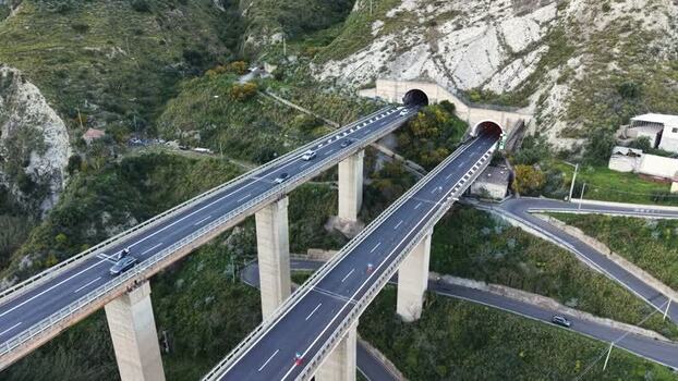 Aerial view of highway viaduct and tunnels in Taormina Italy.