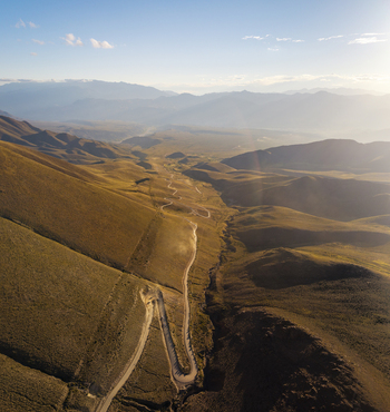 Aerial view of the winding road leading towards the Hornocal mountain range in the arid landscape of Humahuaca Jujuy Province Argentina. Aerial view of the winding road leading towards the Hornocal mountain range in the arid landscape of Humahuaca Jujuy Province Argentina.