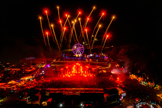 Herzogenaurach Germany 27 July 2025 Aerial view of Open Beatz Festival with a glowing Ferris wheel a crowded main stage and vibrant fireworks lighting up the night sky. Herzogenaurach Germany 27 July 2025 Aerial view of Open Beatz Festival with a glowing Ferris wheel a crowded main stage and vibrant fireworks lighting up the night sky.