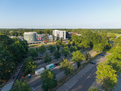 Diepenbeek Vlaanderen Belgium 01 July 2026 Aerial view of University College Leuven Limburg Campus Diepenbeek with modern buildings lush green trees and a parking area. Diepenbeek Vlaanderen Belgium 01 July 2026 Aerial view of University College Leuven Limburg Campus Diepenbeek with modern buildings lush green trees and a parking area.