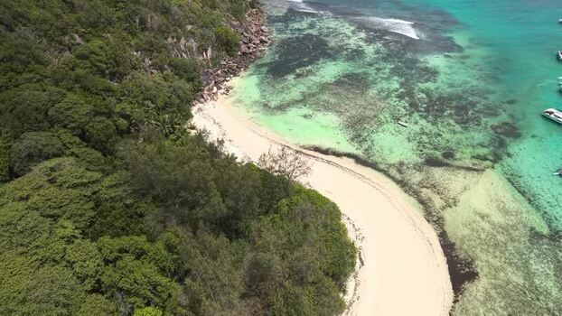 Aerial view of a tropical beach and turquoise waters Seychelles.