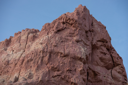 View of Paint Mines Interpretive Park showing colorful clay rock formations and hoodoos under a clear blue sky in Calhan Colorado United States.