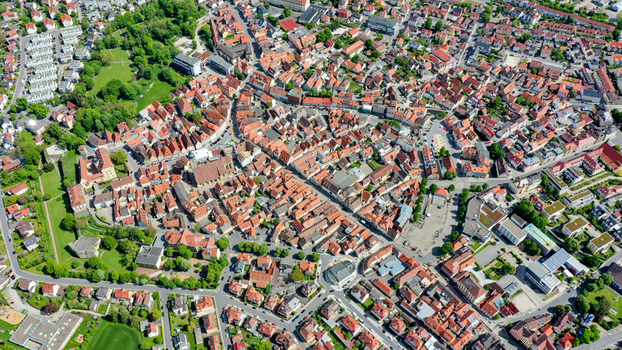 Aerial view of the historic old town of Forchheim with its traditional red tiled rooftops central church and lush green parks under bright sunlight in Forchheim Bavaria Germany. Aerial view of the historic old town of Forchheim with its traditional red tiled rooftops central church and lush green parks under bright sunlight in Forchheim Bavaria Germany.