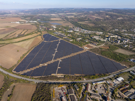 Aerial view of a large solar farm with rows of photovoltaic panels situated in a rural landscape near the city of Lovech Lovech Bulgaria. Aerial view of a large solar farm with rows of photovoltaic panels situated in a rural landscape near the city of Lovech Lovech Bulgaria.