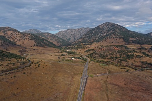Aerial view of a road winding through the valley in the foothills of the Rocky Mountains near Golden Colorado United States.