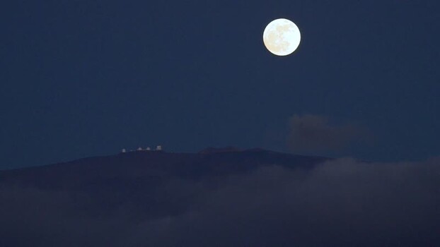 View of observatories on a mountain with a full moon United States. View of observatories on a mountain with a full moon United States.