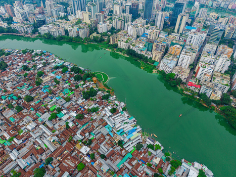 Dhaka Bangladesh 19 June 2026 Aerial view of Gulshan Lake separating dense residential neighborhoods from modern high rise buildings in the city.