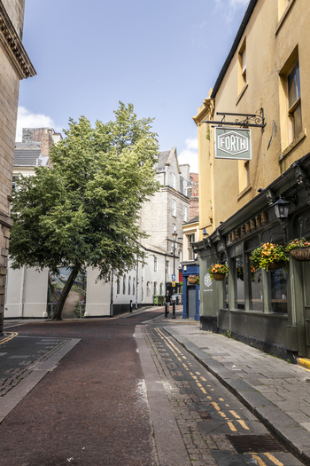 Newcastle upon Tyne United Kingdom 13 July 2026 View of The Forth pub with its sign on a quiet street corner featuring a large tree historic stone buildings and cobblestone pavement. Newcastle upon Tyne United Kingdom 13 July 2026 View of The Forth pub with its sign on a quiet street corner featuring a large tree historic stone buildings and cobblestone pavement.