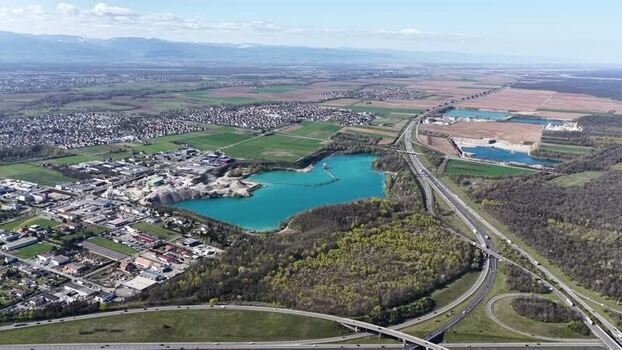 Aerial view of blue lake and highway France.