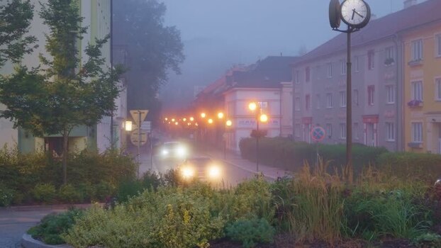 View of a foggy street in Olomouc at dawn Czechia. View of a foggy street in Olomouc at dawn Czechia.