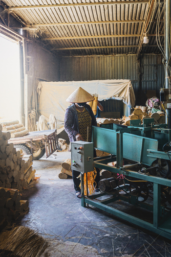 Ung Hoa Vietnam 23 July 2023 View of a woman working with incense in a traditional workshop Quang Phu Cau Vietnam.