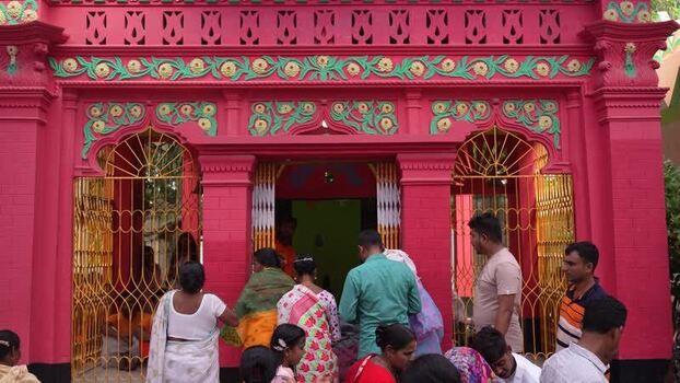 View of people at a pink temple in Godagari Upazila Bangladesh. View of people at a pink temple in Godagari Upazila Bangladesh.