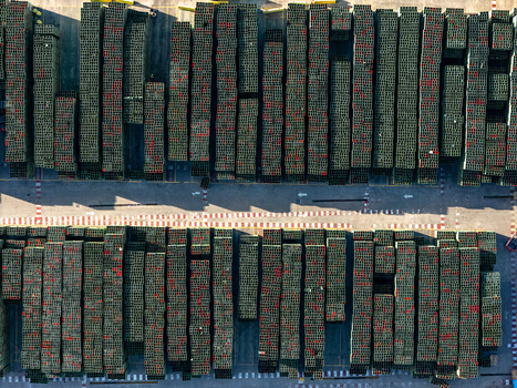 Aerial view of a beer industrial complex with organized rows of stacked plastic crates on a paved yard in Santo Domingo Dominican Republic. Aerial view of a beer industrial complex with organized rows of stacked plastic crates on a paved yard in Santo Domingo Dominican Republic.