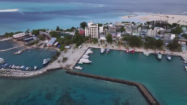 Aerial view of Gulhi island harbor and turquoise waters Maldives. Aerial view of Gulhi island harbor and turquoise waters Maldives.