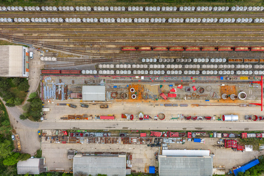 Aerial view of a large cement plant with railway tracks freight wagons and storage silos in Mokra Horakov Jihomoravsky kraj Czechia. Aerial view of a large cement plant with railway tracks freight wagons and storage silos in Mokra Horakov Jihomoravsky kraj Czechia.