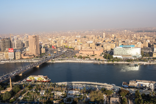 Cairo Egypt 19 October 2025 View of the Nile River shimmering under the sunlight framed by the iconic Cairo Tower and the bustling cityscape. Cairo Egypt 19 October 2025 View of the Nile River shimmering under the sunlight framed by the iconic Cairo Tower and the bustling cityscape.