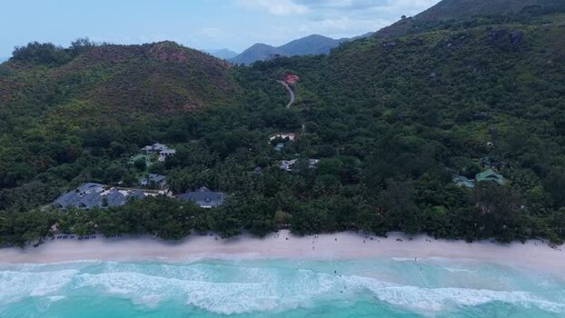 Aerial view of Anse Lazio beach and lush hills in Seychelles.