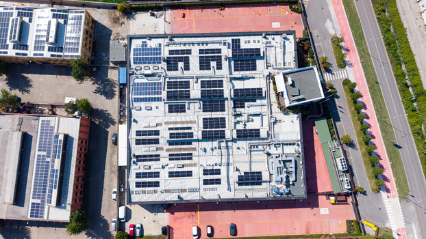Aerial view of a food additive manufacturing plant with rooftop solar panels and industrial equipment in Milan Lombardy Italy. Aerial view of a food additive manufacturing plant with rooftop solar panels and industrial equipment in Milan Lombardy Italy.