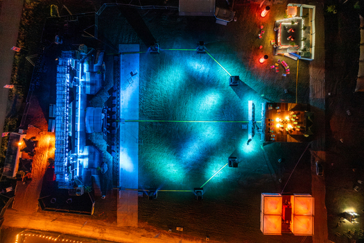 Herzogenaurach Germany 25 July 2025 Aerial view of the Open Beatz Festival stage at night with vibrant blue and orange lighting illuminating the festival grounds. Herzogenaurach Germany 25 July 2025 Aerial view of the Open Beatz Festival stage at night with vibrant blue and orange lighting illuminating the festival grounds.