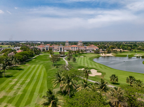 Ahmedabad Gujarat India 21 March 2026 Aerial view of Kalhaar Blues and Greens Golf Club with lush fairways sand bunkers a large water hazard and the clubhouse.