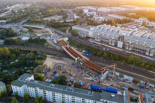 Aerial view of the Ringbahnbrucke bridge construction site at the Funkturm interchange with cranes railway tracks and urban infrastructure in Berlin Berlin Germany. Aerial view of the Ringbahnbrucke bridge construction site at the Funkturm interchange with cranes railway tracks and urban infrastructure in Berlin Berlin Germany.