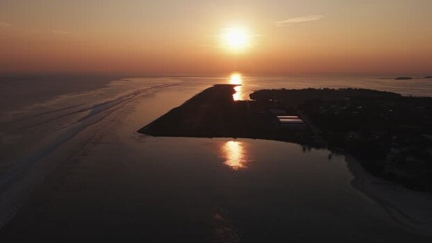 Aerial view of a tropical island runway at sunset Maldives. Aerial view of a tropical island runway at sunset Maldives.