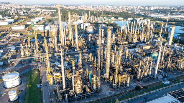 Aerial view of the petrochemical complex with tall distillation columns storage tanks and industrial infrastructure in Santo Andre State of Sao Paulo Brazil.